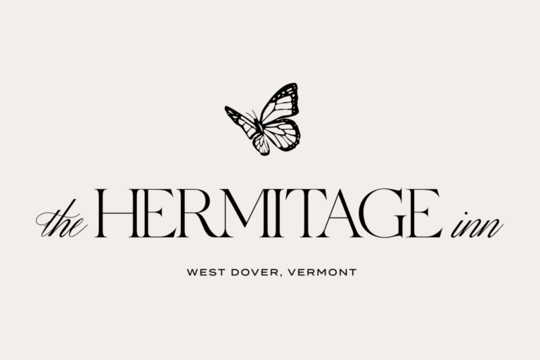the logo for the Hermitage Inn